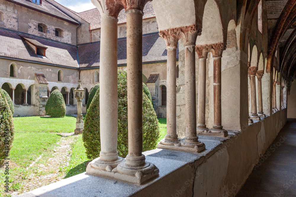 Fototapeta premium Artistic image of old Romanesque cloister in the Brixen cathedral, South Tyrol, Italy 