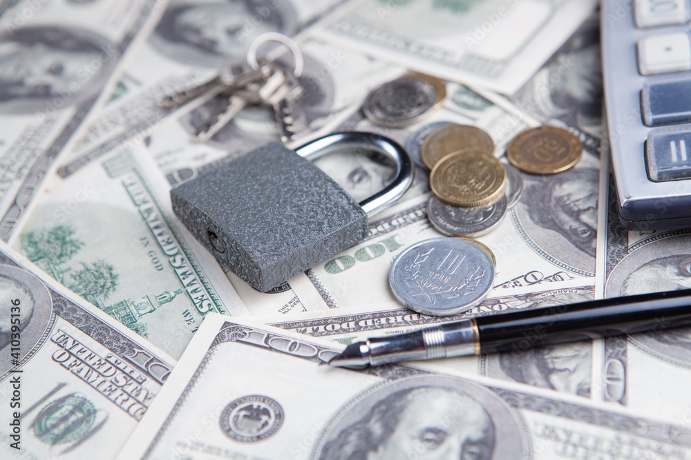 Padlock on the dollar bills. Close up. Business concept. Padlock on the dollar bills. Close up. Business concept.