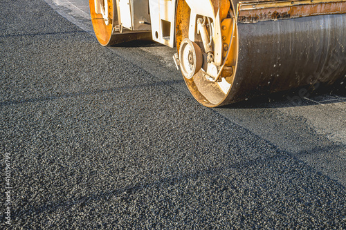 Hot mix asphalt paving and road work - Flatten out the hot asphalt road with road roller