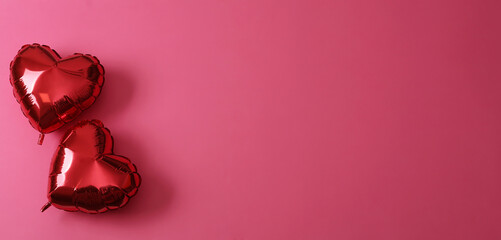 Red heart shaped balloons on pink background, flat lay with space for text. Saint Valentine's day celebration