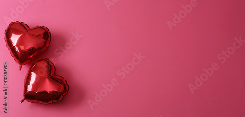 Fotótapéta Red heart shaped balloons on pink background, flat lay with space for text