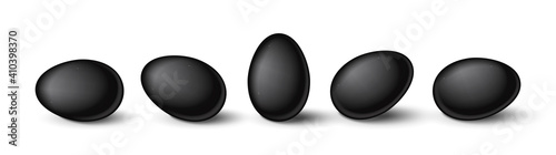 Set of realistic black eggs on white background. Realistic eggs in different positions. Vector illustration with 3d decorative objects for Easter design.