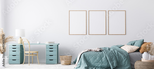Fototapeta Naklejka Na Ścianę i Meble -  Blue Scandinavian bedroom with three vertical frames in bright design, poster mock up on white wall background	