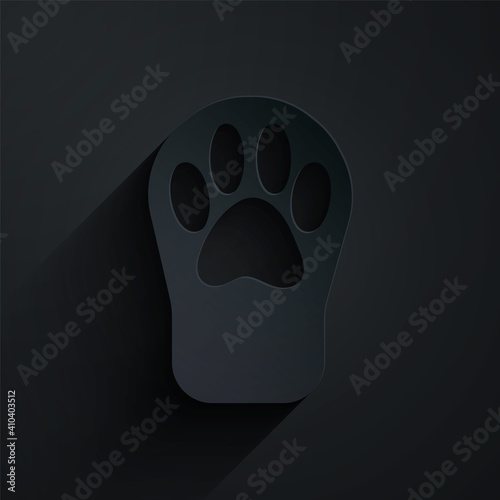 Paper cut Paw print icon isolated on black background. Dog or cat paw print. Animal track. Paper art style. Vector.