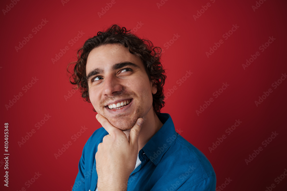 Happy handsome man smiling and looking upward Happy handsome man smiling and looking upward