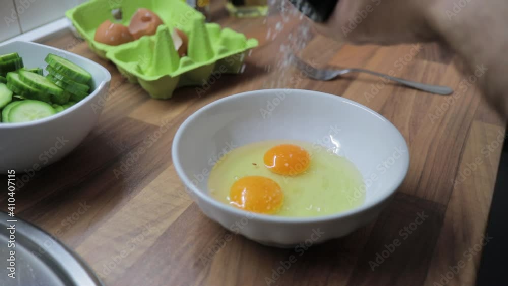 Chef whisking eggs in a bowl Chef whisking eggs in a bowl