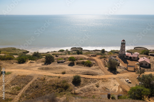 Obraz na płótnie Lighthouse at the beach at the sea w salonie