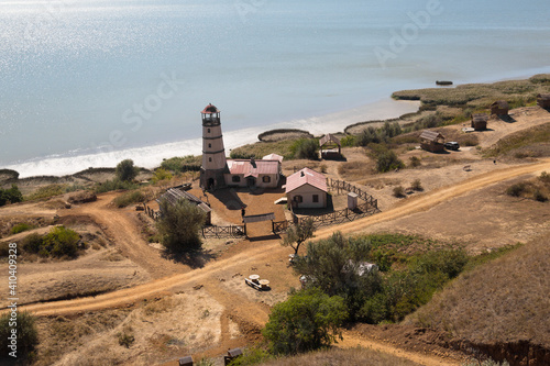 Obraz na płótnie Lighthouse at the beach at the sea w salonie