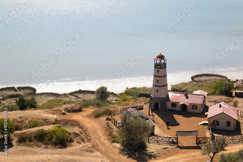 Obraz na płótnie Lighthouse at the beach at the sea w salonie