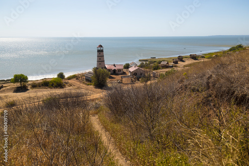 Obraz na płótnie Lighthouse at the beach at the sea w salonie