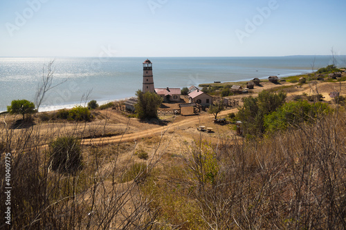 Obraz na płótnie Lighthouse at the beach at the sea w salonie