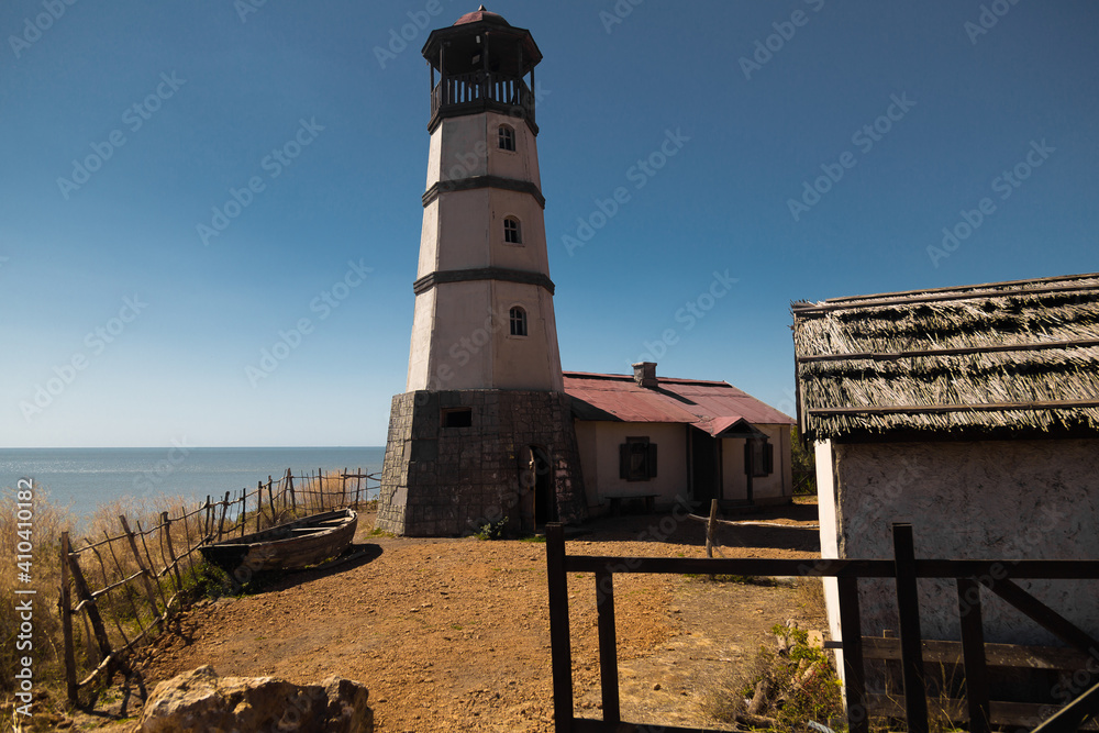 Lighthouse at the beach at the sea