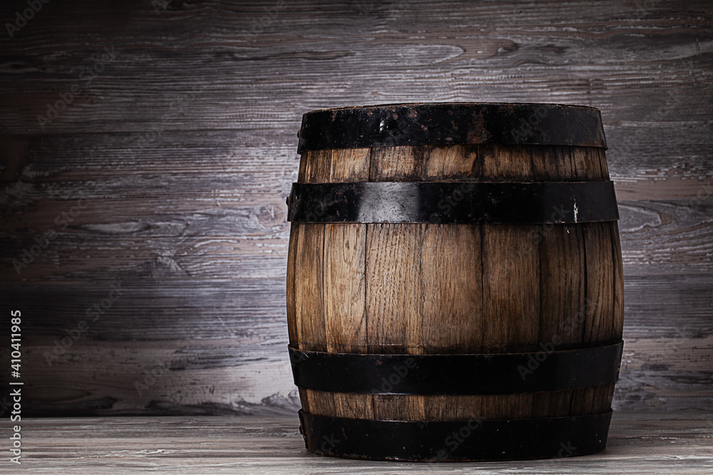 Old wooden barrel standing on table in old cellar Old wooden barrel standing on table in old cellar
