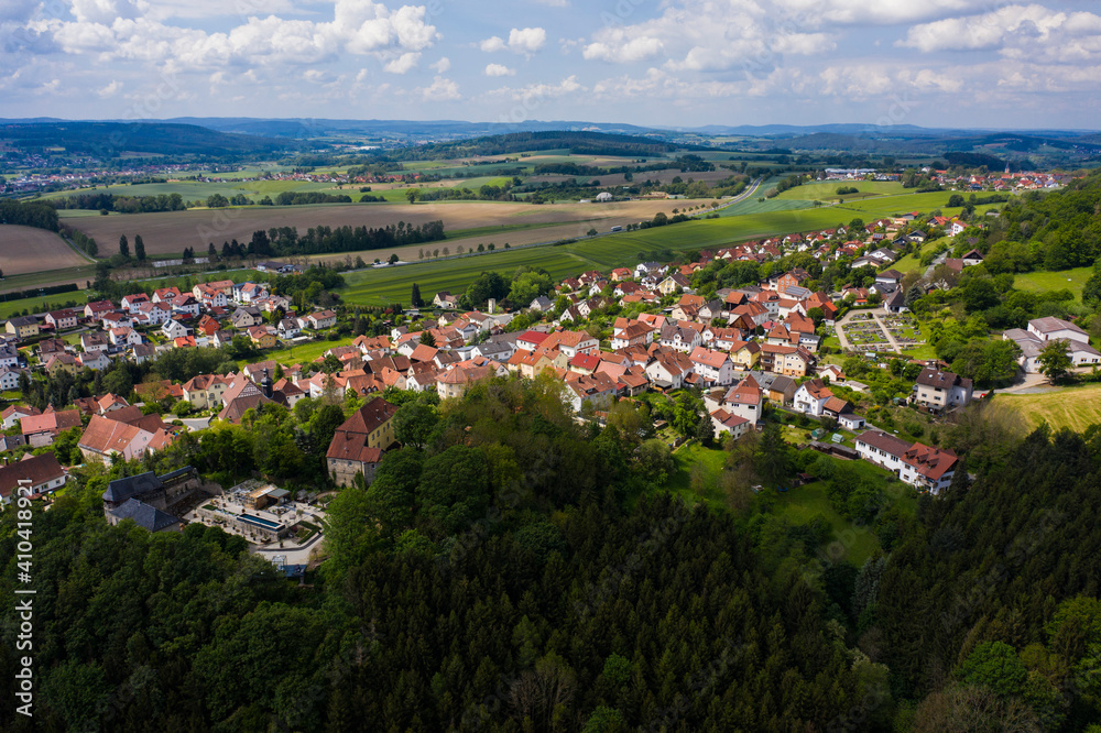 Aerial view of the city and castle Theisenort close to Küps in Germany on a sunny day in spring.	
