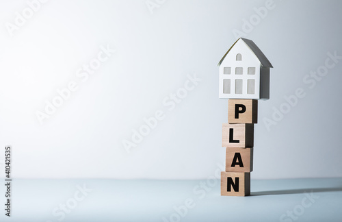 Real estate or property concepts with plan text and model house.business investment