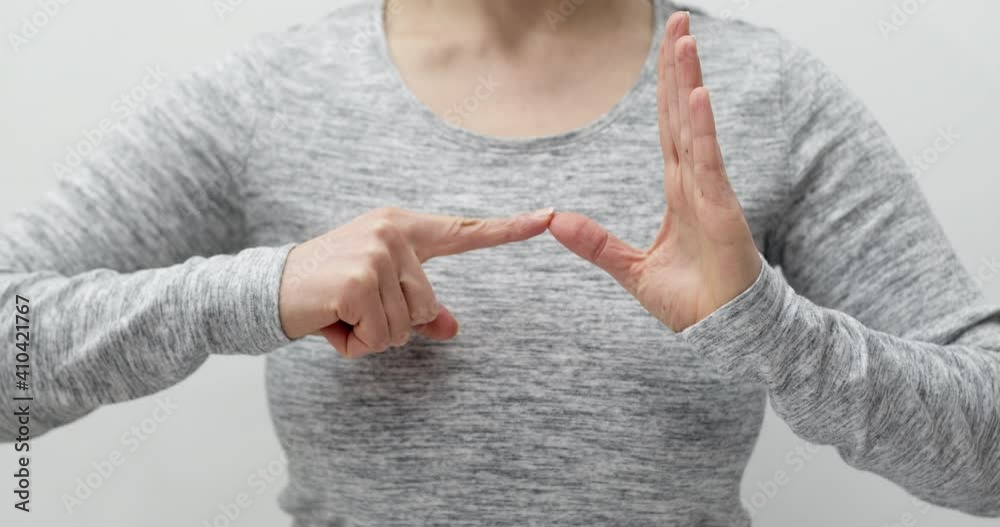 Woman learns sign language to talk. Deaf language. Hand gestures of people with hearing impairment.