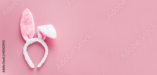 bunny ears headband happy easter on pink  background with copy space horizontal banner for your design 