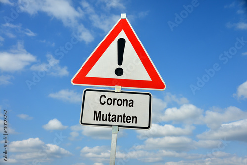 Hamburg, Germany - February 3, 2021: German Traffic warning sign with the note Corona Mutanten - symbolizes the danger from a worldwide epidemic