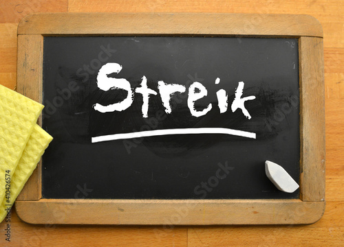 Chalkboard with the german word streik eng strike photo