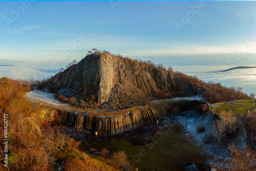 Amazing geological formatoion with fog. Basalt columns hill in upper Balaton region in Hungary. The hungarian name is Hegyesstu.