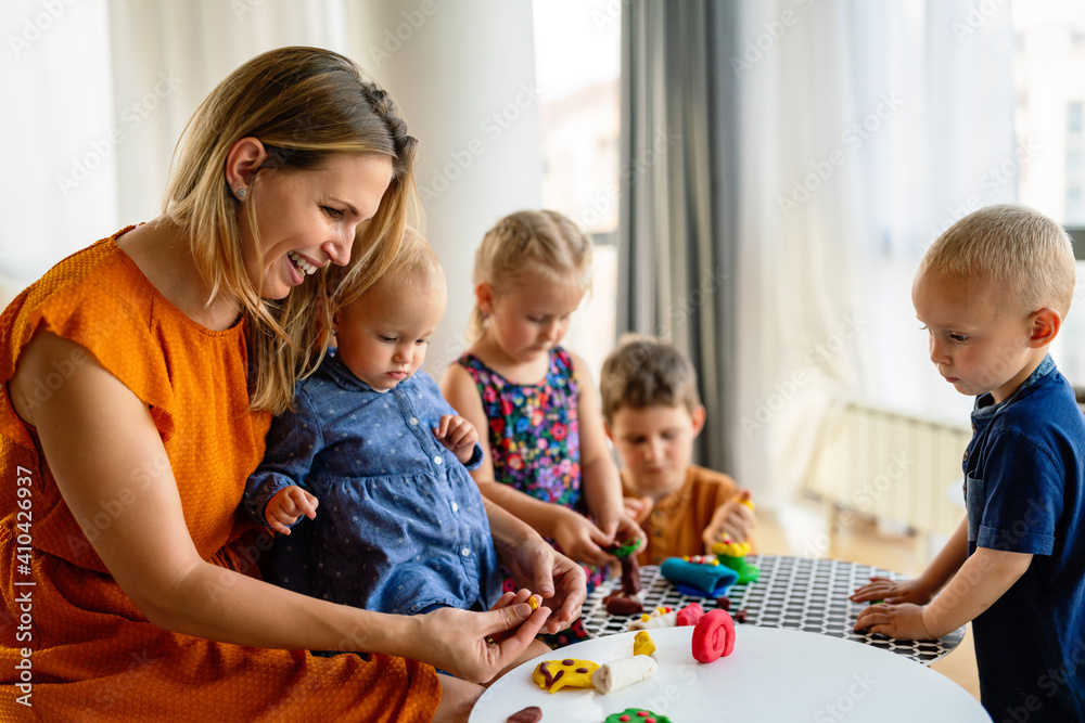 Nursery children having fun and playing with teachers. Nursery children having fun and playing with teachers.