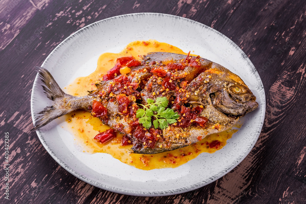 Deep fried pomfret fish and chili sauce Deep fried pomfret fish and chili sauce