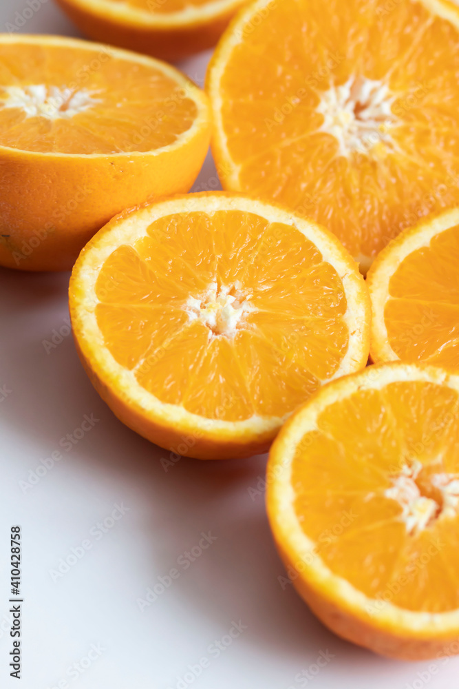 The orange halves are on the table. On a gray and white background. The orange halves are on the table. On a gray and white background.