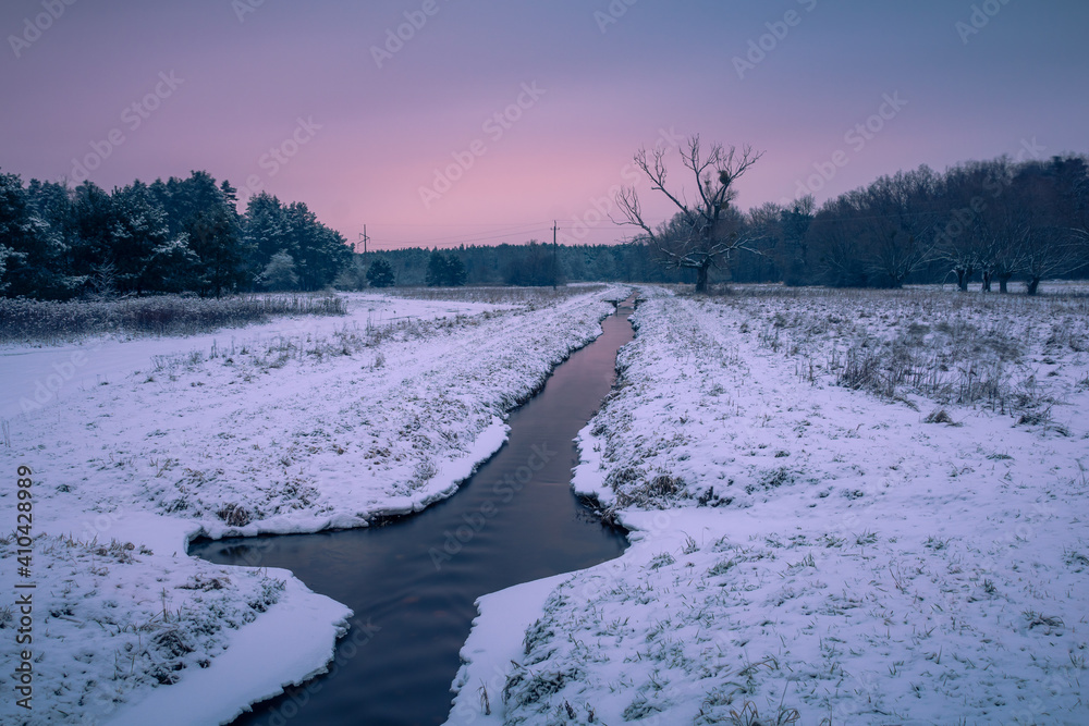 Mala River at winter in Chojnowski landscape park near Konstancin-Jeziorna, Masovia, Poland
