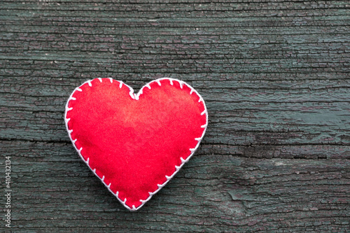 Hand made heart shape, love symbol on wooden background
