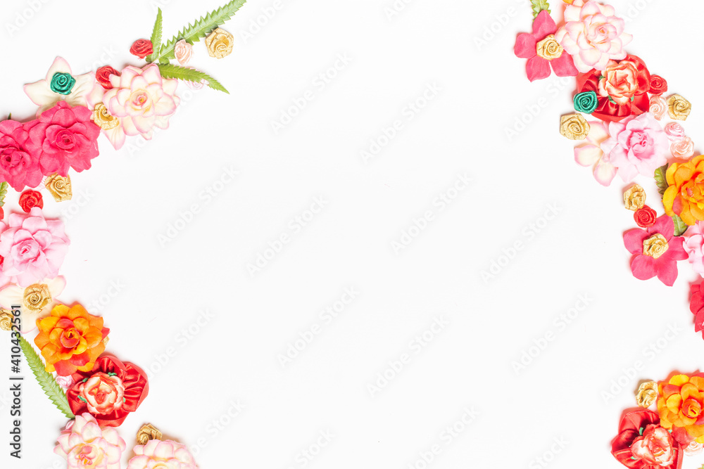 Frame made of rose flowers on white background. Top view with copy space. Frame made of rose flowers on white background. Top view with copy space.