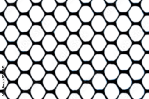 Abstract black mesh pattern background blur effect.