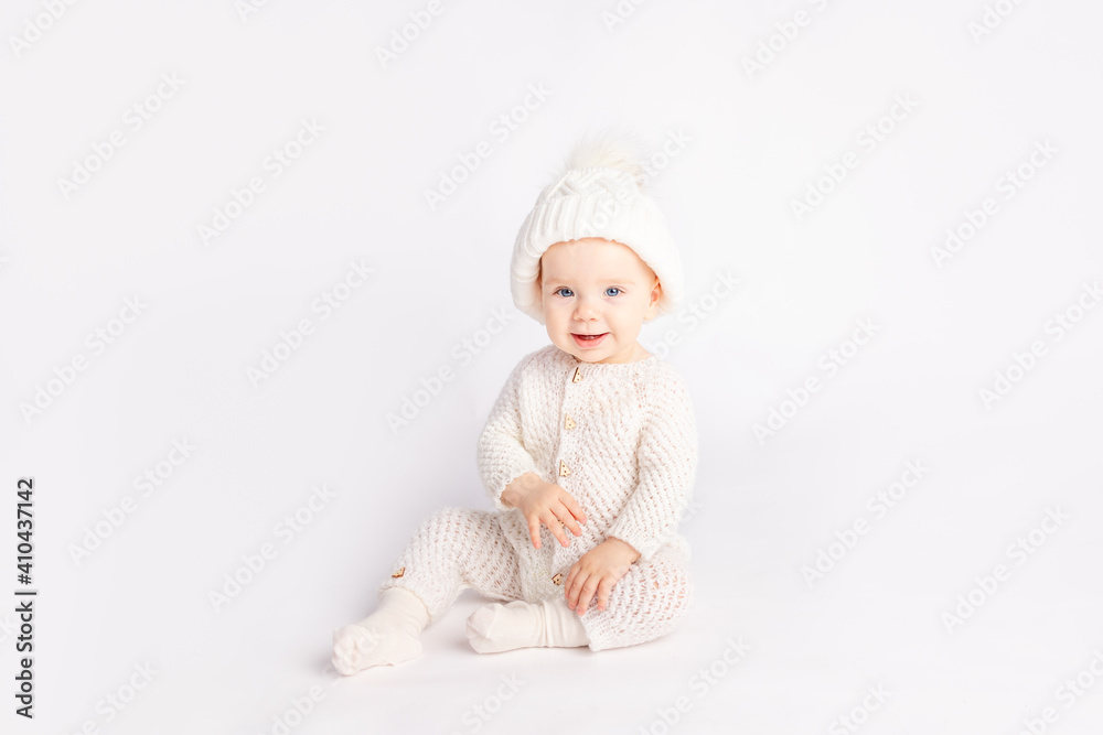 baby in a warm suit and hat on a white isolated background, space for text baby in a warm suit and hat on a white isolated background, space for text