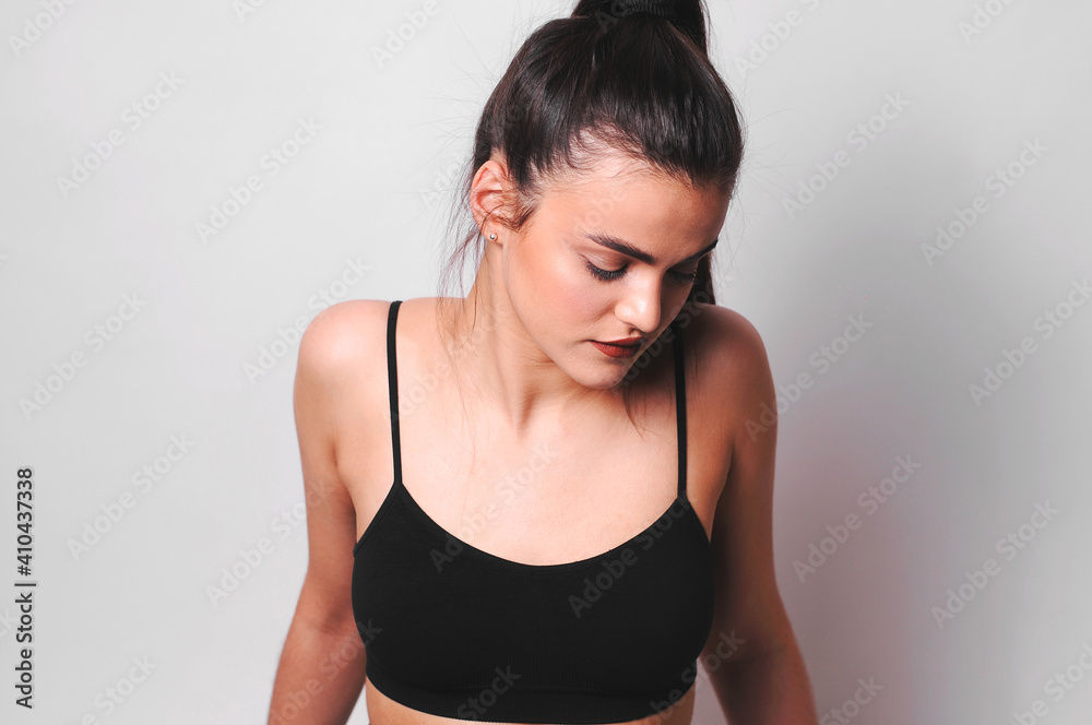 Young girl in a black top.Studio photography. Young girl in a black top.Studio photography.