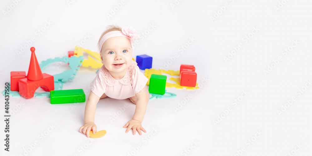 the kid plays with cubes on a white isolated background, space for text, banner the kid plays with cubes on a white isolated background, space for text, banner