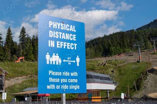 View of Whistler Village Gondola entrance with sign Physical Distance in Effect
