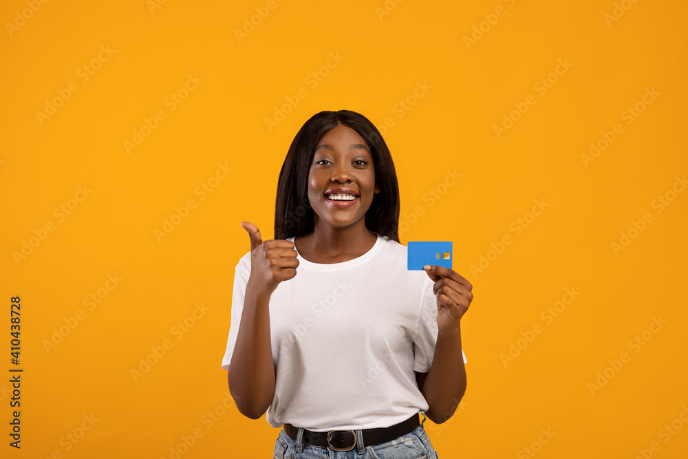 Joyful african american woman recommending credit card Joyful african american woman recommending credit card