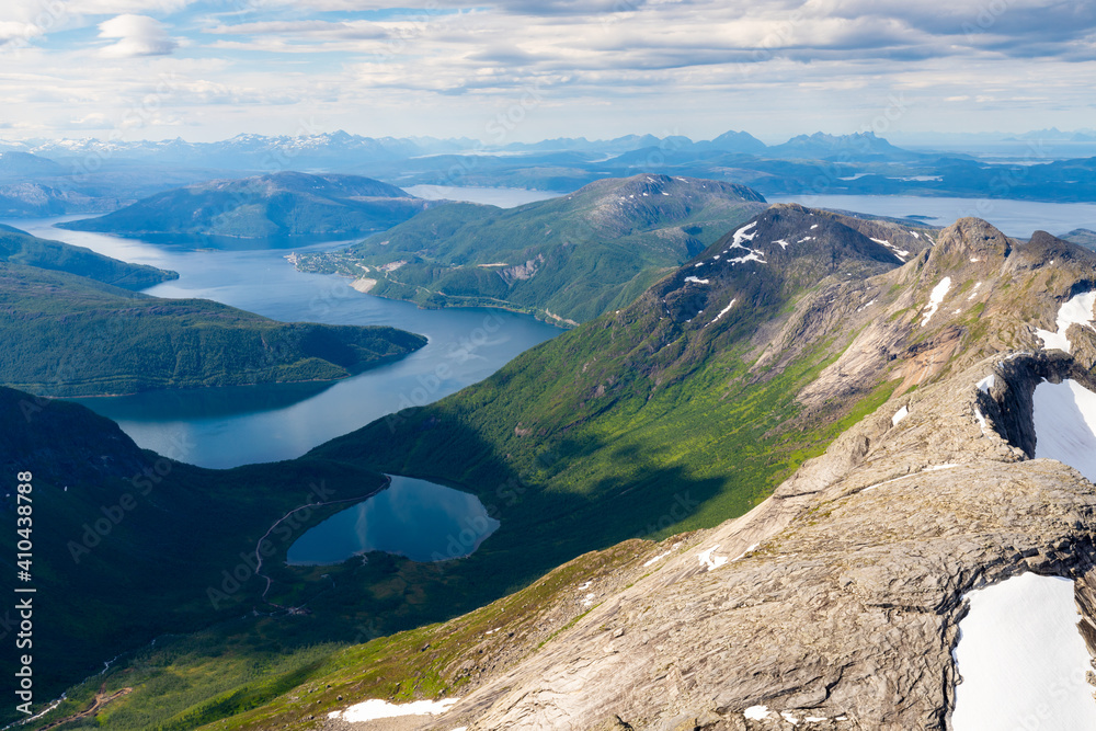 view of norwegian fjord landscape seen from the top of a mountain near Stetinden.