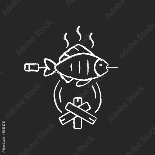 Cooking freshly caught fish chalk white icon on black background. Fres sea food idea. Hobby and leasure activities. Making a fire. Outdoor cooking. Isolated vector chalkboard illustration