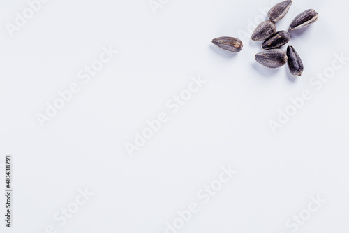 Sunflower seeds, on white background with copy space.