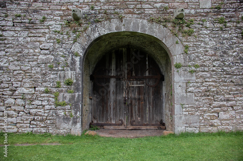 Old wooden door entrance to castle.