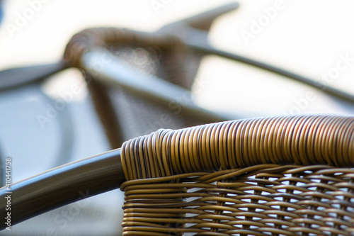 Wicker outdoor patio chairs, rattan, fragment, close-up photo