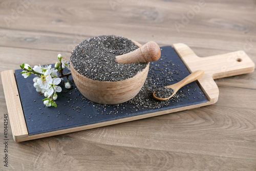 Chia seeds in a wooden mortar photo