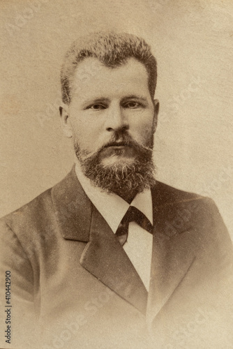 Germany - CIRCA 1910-20s: Rich man portrait close up in studio. Vintage cabinet card Edwardian era male portrait photo