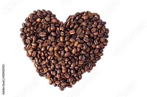 Heart-shaped coffee beans. Roasted, aromatic coffee beans on a white background. Isolate. Concept of Valentine's day or coffee lover's. Soft focus.