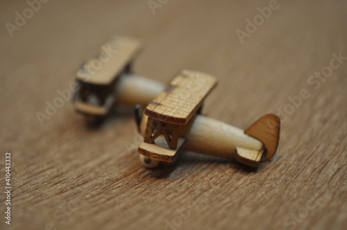 Close up creative shots of small wooden plane models handcrafted from wood, around 3cm X 2cm in size photo