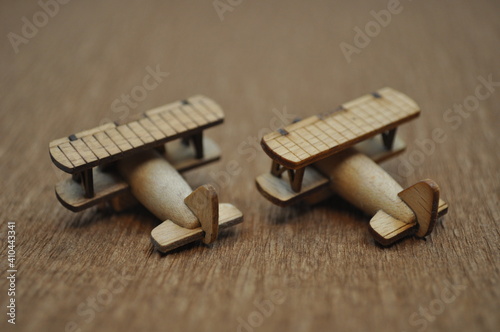 Close up creative shots of small wooden plane models handcrafted from wood, around 3cm X 2cm in size photo