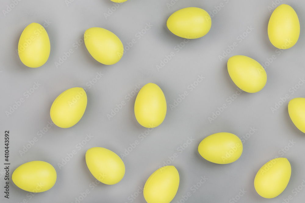 Stylish background with yellow easter eggs isolated on gray background. Flat lay, top view, mockup, overhead, template
