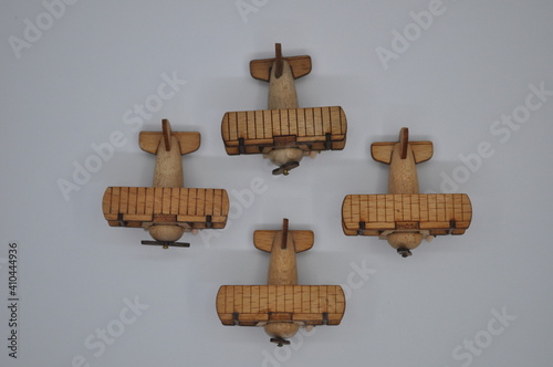 Close up creative shots of small wooden plane models handcrafted from wood, around 3cm X 2cm in size photo