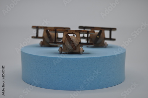 Close up creative shots of small wooden plane models handcrafted from wood, around 3cm X 2cm in size photo