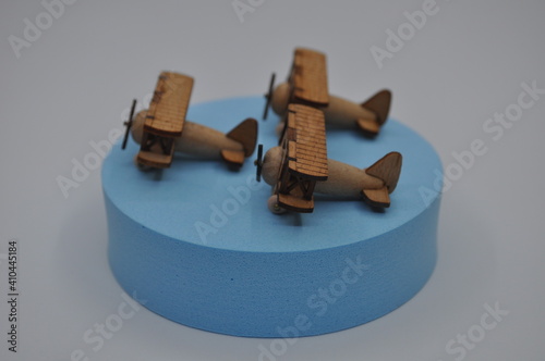 Close up creative shots of small wooden plane models handcrafted from wood, around 3cm X 2cm in size photo